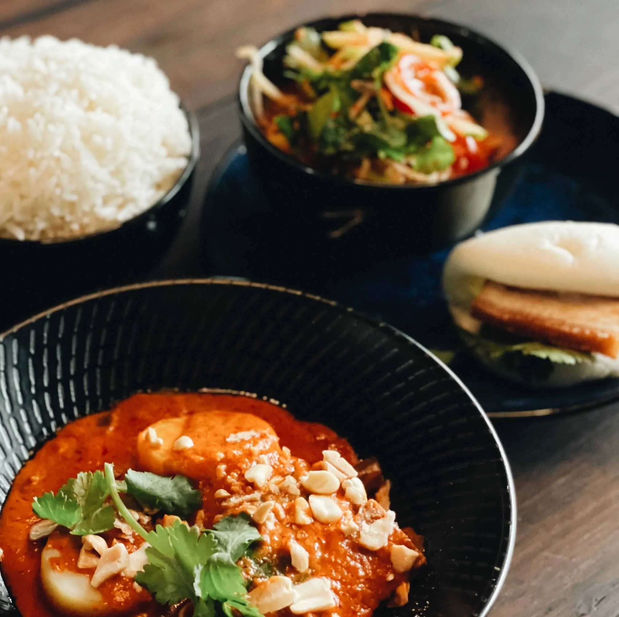 Curry, rice and bao on the Betel Boy table